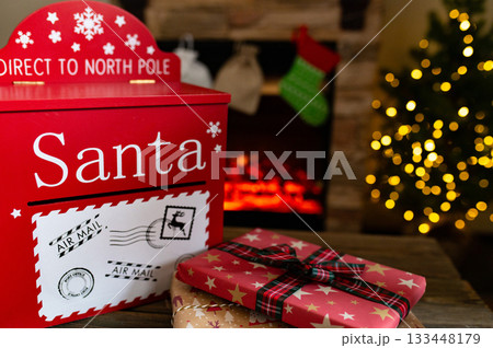 Santa Mailbox with Christmas Gifts and Festive Holiday Decor Indoors 133448179