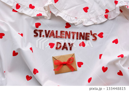Festive St. Valentine's Day background of a white cotton blouse with hearts. 133448815