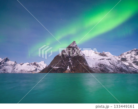 Aurora Borealis in Scandinavia. Norway, Lofoten islands. Northern lights over the mountains. Aurora Borealis in Scandinavia. Norway, Lofoten islands. Northern lights over the mountains. 133449161