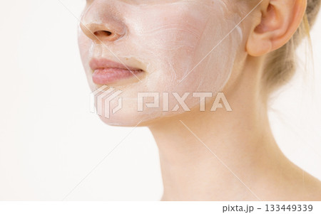 Girl with cream moisture cosmetic on face Girl with cream moisture cosmetic on face 133449339