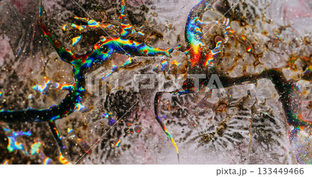 Sparkling liquid. Cracked texture. Defocused gray green blue colorful chemical particles floating on abstract creative background. Sparkling liquid. Cracked texture. Defocused gray green blue colorful chemical particles floating on abstract creative background. 133449466