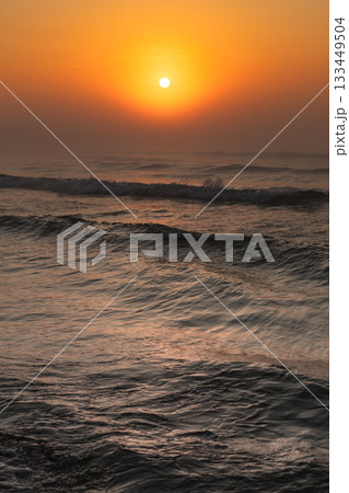 Beatiful red sunset over sea surface 133449504