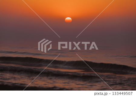 Beatiful red sunset over sea surface 133449507