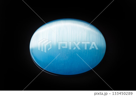 A blue stone with a blue and white stripe 133450289
