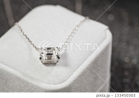 A white box with a necklace inside A white box with a necklace inside 133450303