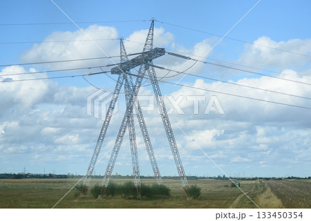 High Voltage Transmission Tower in Rural Field 133450354