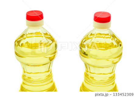 Full bottles of vegetable oil for cooking,salad dressing on white Full bottles of vegetable oil for cooking,salad dressing on white 133452309