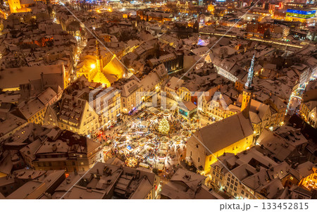 Aerial night View of Tallinn with the Town Hall Square in winter, roofs with snow, Christmas mood 133452815