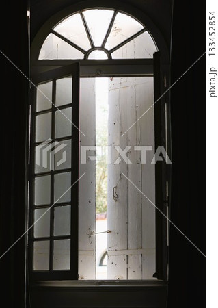 Old vertical window and sun light Old vertical window and sun light 133452854