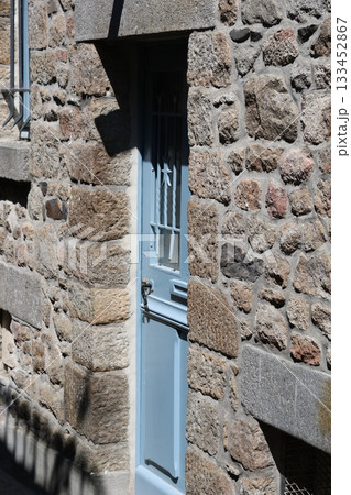 Old blue door in rocky castle. 133452867