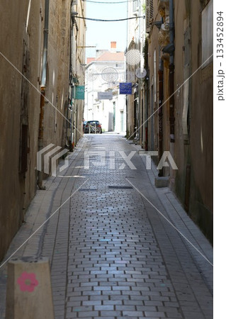 Small narrow passage between houses Small narrow passage between houses 133452894