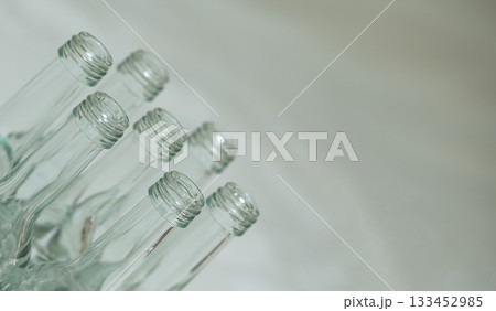 neat bottle display, stylish and tranquil depiction of glass bottles with ecofriendly and beverage themes 133452985