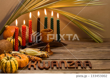 Kwanzaa Celebration Setup. A festive Kwanzaa display with candles, fruits, and decorative elements 133453002