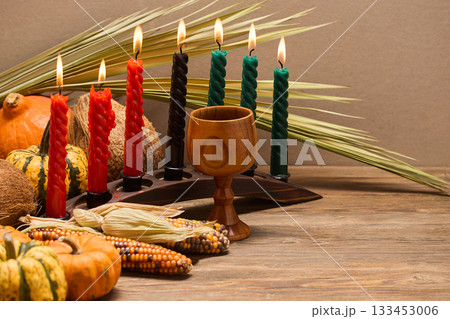 Kwanzaa Celebration Setup. A festive Kwanzaa display with candles, fruits, and decorative elements 133453006