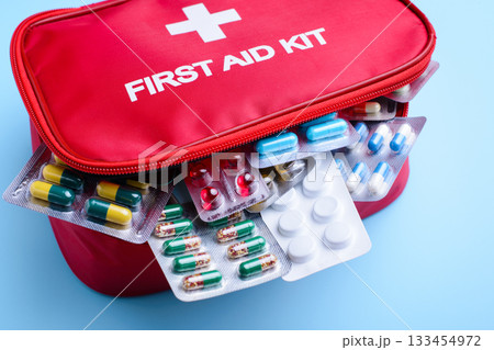 Red box full of different medicine, pills and capsules used to treat people from wide variety of illnesses and diseases Red box full of different medicine, pills and capsules used to treat people from wide variety of illnesses and diseases 133454972