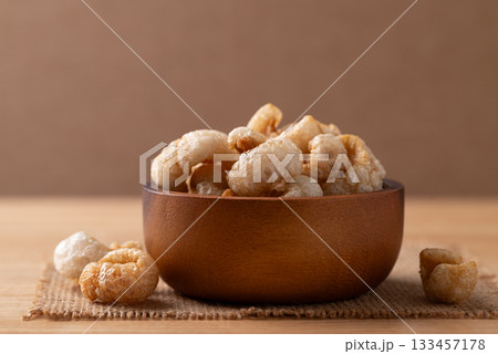 Pork rind in a wooden bowl, Northern Thai food 133457178