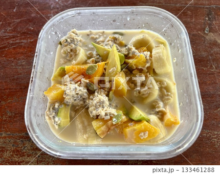 Close up view of delicious food, Overnight Oats, Banana, Avocado Breakfast in a Mug 133461288