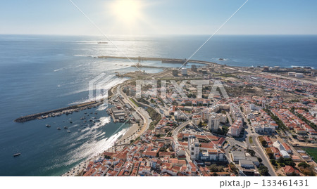sines portugal. sunset over calm coastal area featuring leisure activities and vessels, vivid aerial depiction of tranquil sines bay with sandy shores and boating sines portugal. sunset over calm coastal area featuring leisure activities and vessels, vivid aerial depiction of tranquil sines bay with sandy shores and boating 133461431