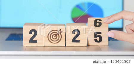 2025 end year to Happy New Year 2026 block with dartboard icon against computer laptop background. Goal, Target, Resolution, strategy, plan, Action, mission, motivation, and New Year start concepts 133461507