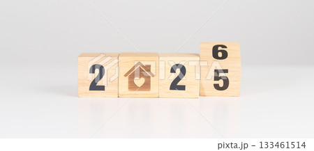 2025 end year to Happy New Year 2026 with Home and Heart block. Property investment, House Mortgage, Real Estate tax, homeless, donation, Financial and happy family concepts 133461514