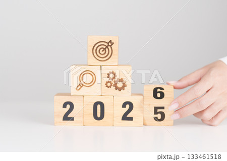 Happy New Year 2026 block with wood block with business goal, strategy, target, mission, action, objective, teamwork, research, feedback and idea concept 133461518