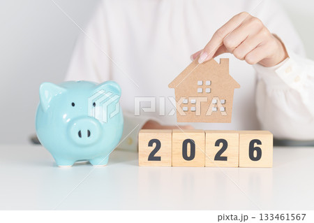 Happy New Year 2026 with house model and Coins stack. real estate, Home loan, tax, investment, mortgage, financial, savings and New Year Resolution concepts Happy New Year 2026 with house model and Coins stack. real estate, Home loan, tax, investment, mortgage, financial, savings and New Year Resolution concepts 133461567