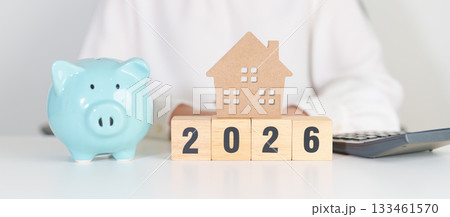 Happy New Year 2026 with house model and Coins stack. real estate, Home loan, tax, investment, mortgage, financial, savings and New Year Resolution concepts Happy New Year 2026 with house model and Coins stack. real estate, Home loan, tax, investment, mortgage, financial, savings and New Year Resolution concepts 133461570