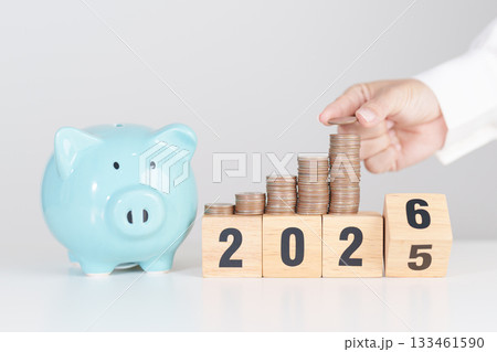 2025 end year to Happy New Year 2026 with piggy bank. Resolution, Goals, Plan, Action, Money Saving, Retirement fund, Pension, Investment and Financial concepts 133461590