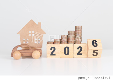 2025 end year to Happy New Year 2026 with car and Home model with coin stack. Car loan, Interest rate, real estate, house, Insurance, Financial, Repair, Tax, mortgage and Maintenance 133461591