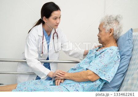 Asian doctor checking and treat elderly woman patient health in hospital. Asian doctor checking and treat elderly woman patient health in hospital. 133462261