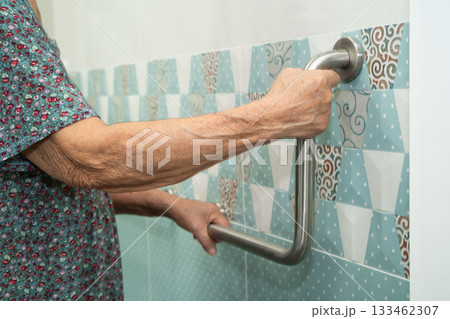 Asian elderly woman patient use toilet bathroom handle security in nursing hospital, healthy strong medical. Asian elderly woman patient use toilet bathroom handle security in nursing hospital, healthy strong medical. 133462307