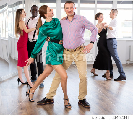 Man and woman dancing waltz in couple during lesson at studio Man and woman dancing waltz in couple during lesson at studio 133462341