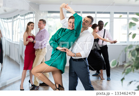Man and woman dancing waltz in couple during lesson at studio 133462479