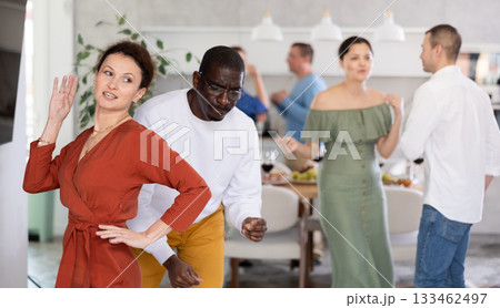 Joyous lively woman dancing at friendly house party Joyous lively woman dancing at friendly house party 133462497