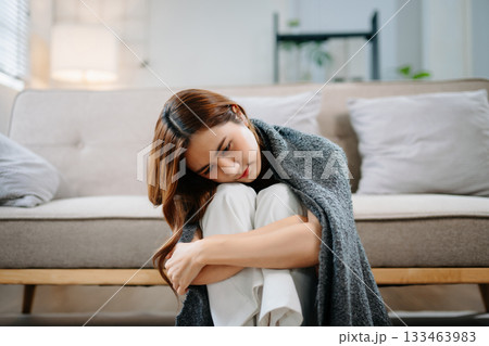 Asian woman sit Depression Dark haired pensive glance Standing by window and anxiety Copy space. Asian woman sit Depression Dark haired pensive glance Standing by window and anxiety Copy space. 133463983