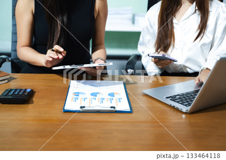 Business team meeting. professional investor working new start up project. Finance task. with smart phone and laptop and digital tablet computer 133464118