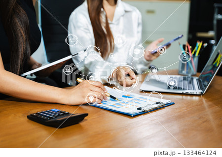 Working team meeting concept, business using laptop and smart phone and digital tablet computer with digital marketing media in virtual icon network diagram office Working team meeting concept, business using laptop and smart phone and digital tablet computer with digital marketing media in virtual icon network diagram office 133464124