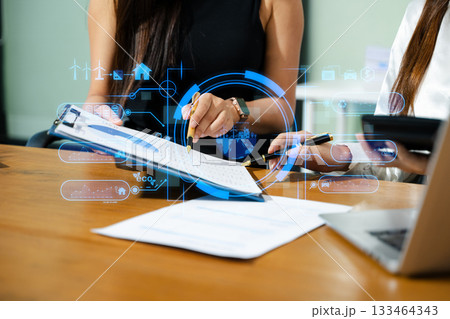 Business team working virtual modern smartphone to reduce CO2 emissions carbon footprint climate change to limit global warming.Sustainable development and green business concept. 133464343