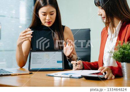 Business team meeting. professional investor working new start up project. Finance task. with smart phone and laptop and digital tablet Business team meeting. professional investor working new start up project. Finance task. with smart phone and laptop and digital tablet 133464824