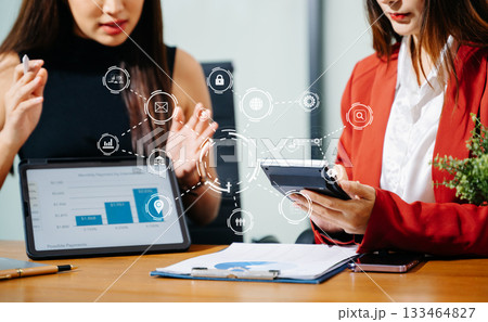 Working team meeting concept, business using laptop and smart phone and digital tablet computer with digital marketing media  in virtual icon network diagram office 133464827