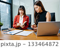 Business portrait two woman asian  smile cheerful talk and holding tablet, computer with in agreement ready new project job for work in room office 133464872