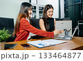 Business portrait two woman asian  smile cheerful talk and holding tablet, computer with in agreement ready new project job for work in room office 133464877
