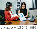 Business portrait two woman asian  smile cheerful talk and holding tablet, computer with in agreement ready new project job for work in room office 133464880