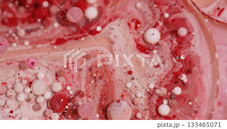 Oil fluid. Paint art. Defocused red white pink color flow wet bubble glitter liquid spreading on abstract bokeh acrylic background. Oil fluid. Paint art. Defocused red white pink color flow wet bubble glitter liquid spreading on abstract bokeh acrylic background. 133465071