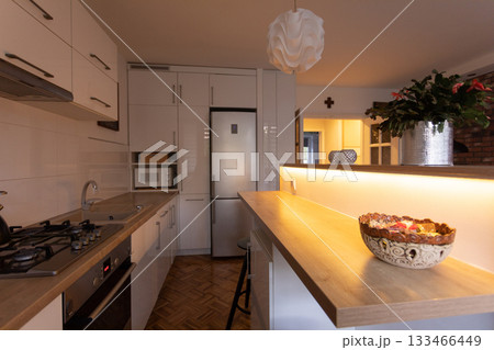 Discover a Modern Kitchen with Elegant Design that enhances Natural Lighting for cooking 133466449