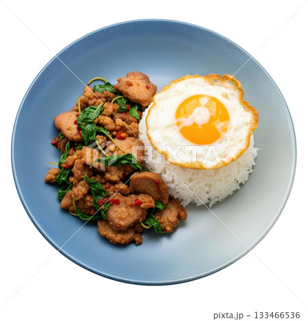 Delicious Thai basil pork stir fry with white rice and fried egg. savory traditional Asian meal on plate Delicious Thai basil pork stir fry with white rice and fried egg. savory traditional Asian meal on plate 133466536