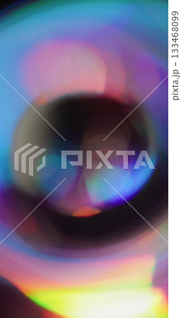 Prism bokeh round. Leak illumination. Neon color sphere spin art kaleidoscope on black. Purple blue yellow abstract blur background. Prism bokeh round. Leak illumination. Neon color sphere spin art kaleidoscope on black. Purple blue yellow abstract blur background. 133468099