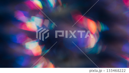 Blur reflection lens. Neon light leak. Color defocused kaleidoscope flash. Purple blue red spectrum sphere on dark abstract background. 133468222