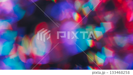 Bokeh holographic light. Beam prism. Rainbow color circles shimmering in bright sphere. Neon refraction lens abstract blur background. Bokeh holographic light. Beam prism. Rainbow color circles shimmering in bright sphere. Neon refraction lens abstract blur background. 133468258