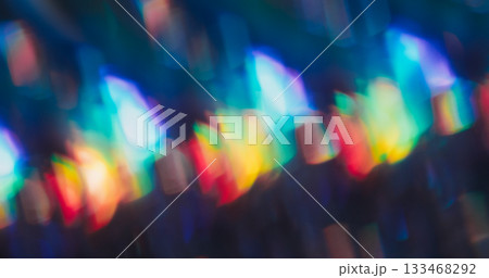 Defocused shimmering flare. Gradient light. Colorful twinkle texture mixing beam. Optical neon reflection on dark abstract background. Defocused shimmering flare. Gradient light. Colorful twinkle texture mixing beam. Optical neon reflection on dark abstract background. 133468292